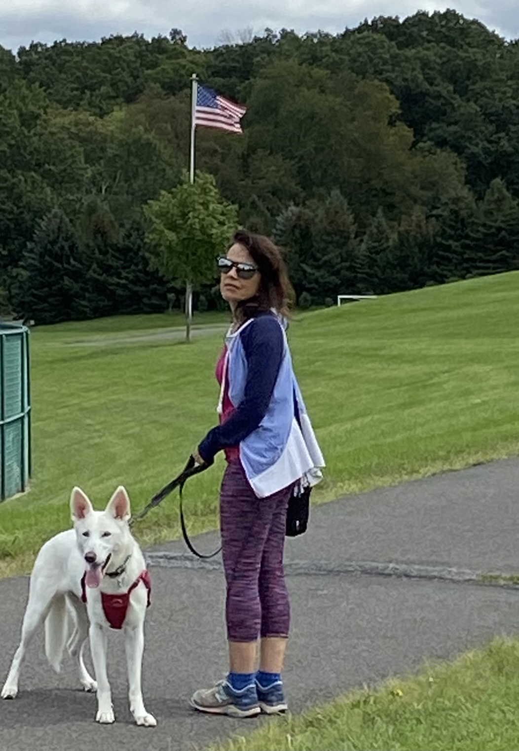 Margaret walking Ella through the park in autumn